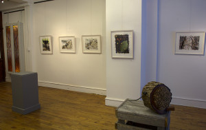 view of framed artwork installed in gallery white walls